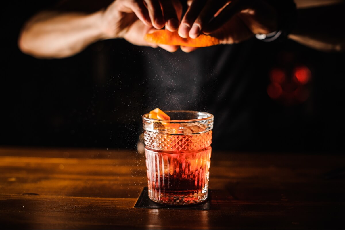 Image of a bartender creating a cocktail